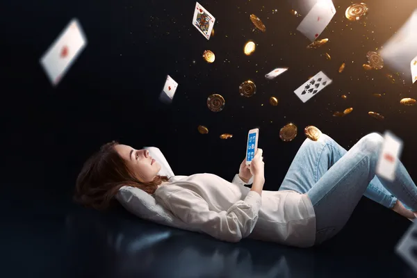 BDKK App — Enjoy seamless gaming on your smartphone A young woman relaxing with her phone while dynamic casino elements float around her, illustrating the smooth mobile experience offered by the BDKK app.