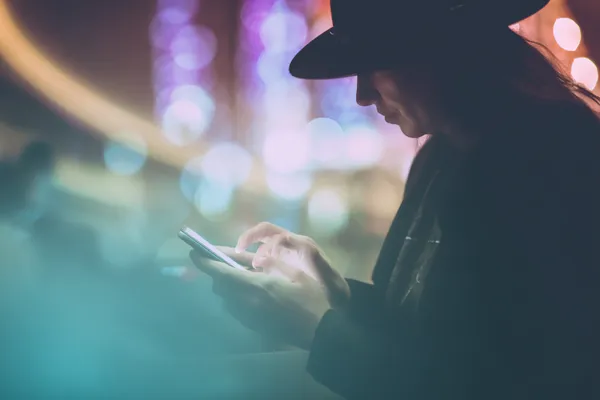 A confident dealer surrounded by casino chips inviting players to access their BDKK account, reflecting quick and easy login options.